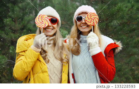 Happy smiling women friends having fun, celebration, joyful girlfriends together on Christmas tree 133228593