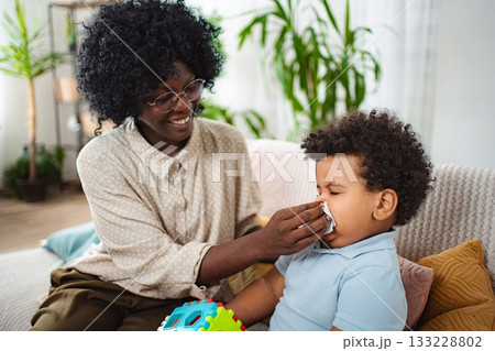 Doctor giving healthcare advice to family Doctor giving healthcare advice to family 133228802
