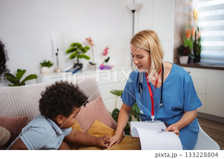 Doctor talking to child and mother Doctor talking to child and mother 133228804