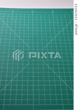 green cutting mat board on white background with line and scale measure guide pattern for art design 133234723