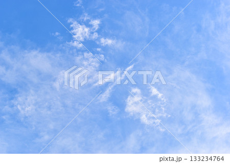 beautiful blue sky and white fluffy group of clouds with sunrise in the morning, natural background beautiful blue sky and white fluffy group of clouds with sunrise in the morning, natural background 133234764