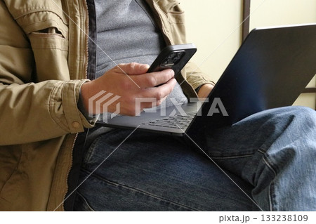 Man working on laptop indoors 133238109