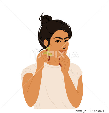South Asian non binary person using gua sha tool, inclusive vector skincare self care routine illustration for beauty, diversity, and wellness 133238218