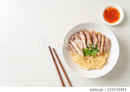 dried noodles with stewed duck in white bowl dried noodles with stewed duck in white bowl 133238943