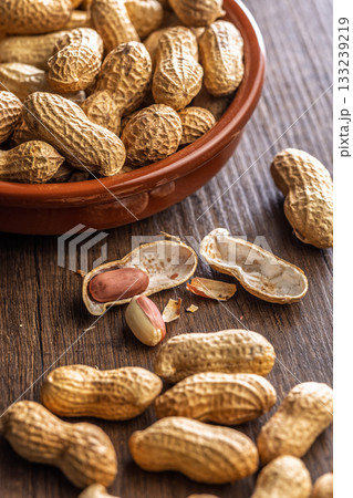 Peanuts in shell. Groundnuts on wooden table. Peanuts in shell. Groundnuts on wooden table. 133239219