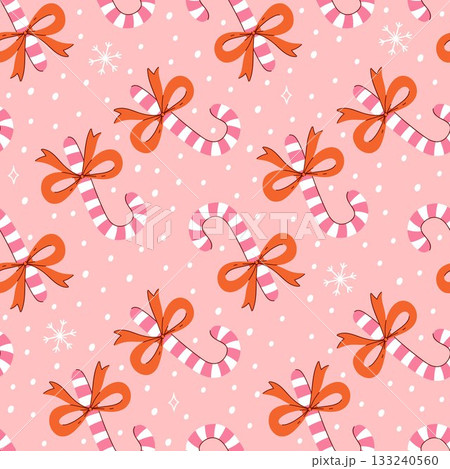 Seamless pattern with lollipop canes and bows. Vector graphics. 133240560