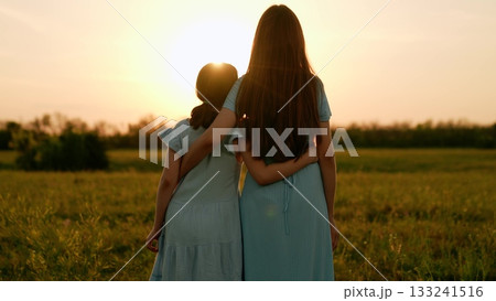 Happy family, mother child hugging asunset, girl hugging parents woman sunset, people outdoors nature, mother daughter bonding, sun flare bokeh, tender caring gesture, love care support, heartfelt Happy family, mother child hugging asunset, girl hugging parents woman sunset, people outdoors nature, mother daughter bonding, sun flare bokeh, tender caring gesture, love care support, heartfelt 133241516