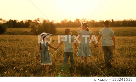 Happy children run towards sunset, girl boy holding hands run play, fun summer holidays, children recreation, kids friendship love, tender youthful companionship, wide open space, childhood love Happy children run towards sunset, girl boy holding hands run play, fun summer holidays, children recreation, kids friendship love, tender youthful companionship, wide open space, childhood love 133241519