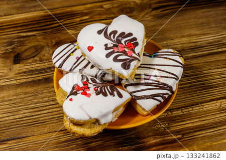 Heart shaped cookies on wooden table. Dessert for Valentine day Heart shaped cookies on wooden table. Dessert for Valentine day 133241862