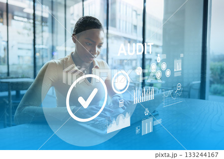 Professional conducting an audit using a digital device in a modern office setting Professional conducting an audit using a digital device in a modern office setting 133244167