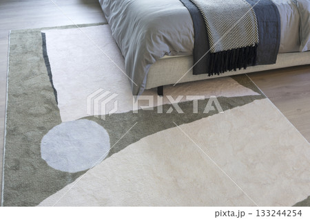 close up view of modern and beautiful graphic pattern carpet in bedroom. close up view of modern and beautiful graphic pattern carpet in bedroom. 133244254