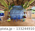 Simple and beautiful traditional Lahu wedding setup in northern Thailand, decorated with banana trees and colorful flowers. 133244910