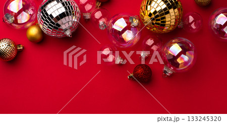 Festive Christmas ornaments on a red background. Festive Christmas ornaments on a red background. 133245320
