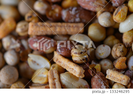 Colorful assortment of crunchy snacks invites delightful munching during a casual gathering 133246295