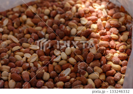 Peanut panorama showing assorted raw and roasted nuts in a rustic market setting Peanut panorama showing assorted raw and roasted nuts in a rustic market setting 133246332