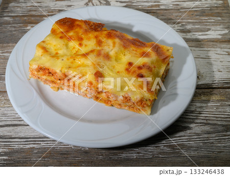 Delicious homemade lasagna baked to perfection with layers of cheese and meat ready to be savored 133246438
