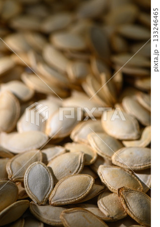 Harvesting pumpkin seeds in autumn with warm golden light highlighting their textures Harvesting pumpkin seeds in autumn with warm golden light highlighting their textures 133246465