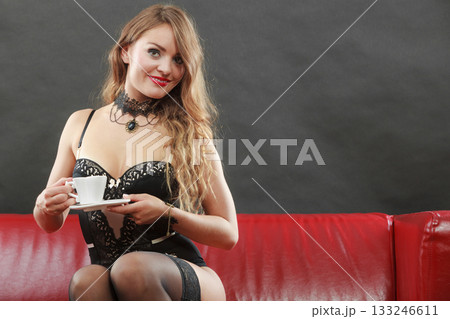 Nice lady sitting on the couch. Nice lady sitting on the couch. 133246611