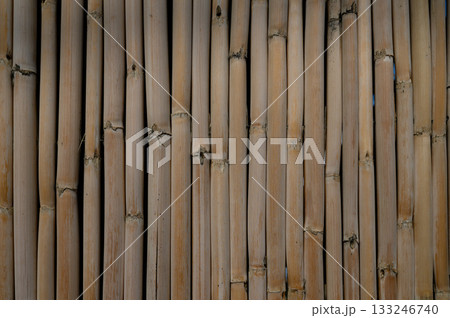 Bamboo wall texture creates a serene backdrop for a peaceful retreat setting 133246740