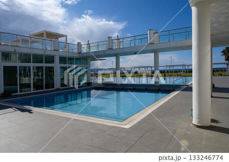 Refreshing oasis near the shoreline invites relaxation and leisure on a sunny afternoon 133246774