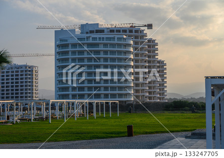 Modern architecture emerges at sunset in a developing coastal resort area Modern architecture emerges at sunset in a developing coastal resort area 133247705