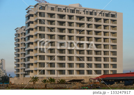Modern architecture stands tall against a clear blue sky in a vibrant cityscape Modern architecture stands tall against a clear blue sky in a vibrant cityscape 133247917