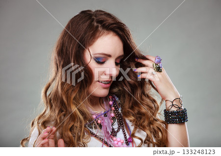 Pretty woman with jewelry necklaces ring bracelets 133248123