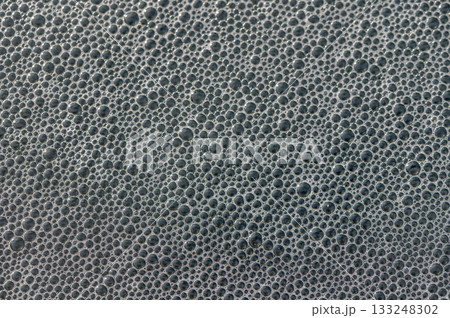 Bubbles forming an intricate pattern on a surface during a creative artistic process Bubbles forming an intricate pattern on a surface during a creative artistic process 133248302