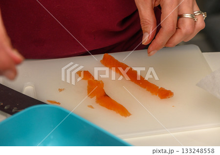 Expertly slicing fresh vegetables in a modern kitchen preparing for a delicious meal 133248558