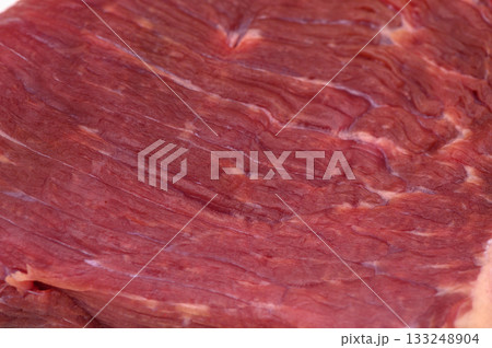 Freshly cut beef revealing rich marbling and deep red hues, ideal for grilling or slow cooking 133248904