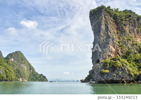 Scenic tropical limestone cliffs and calm sea in thailand s phang nga bay 133249213