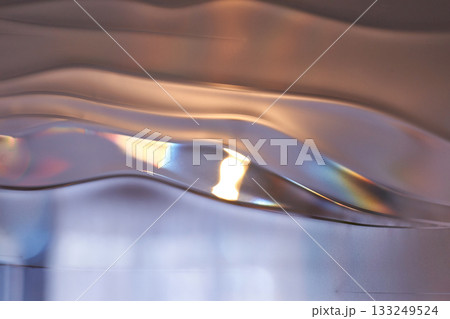 Abstract light and shadow play on wavy metallic surface with iridescent Abstract light and shadow play on wavy metallic surface with iridescent 133249524