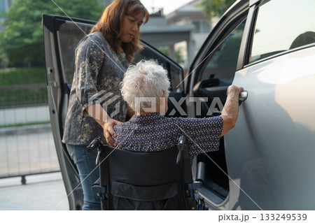 Caregiver help Asian elderly woman disability patient get in her car. Caregiver help Asian elderly woman disability patient get in her car. 133249539