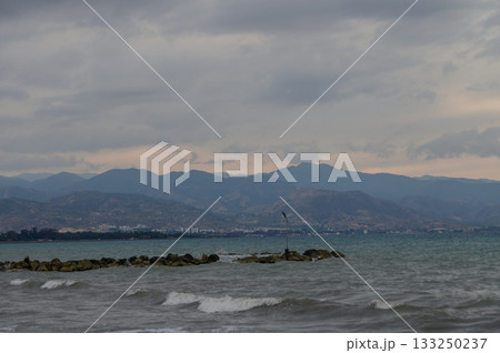 Sunset view of Cyprus mountains from beach 133250237