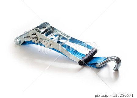 Blue ratchet strap tool with metal buckle and hook, cargo lashing equipment for securing loads, industrial utility for transport and logistics on white background. 133250571