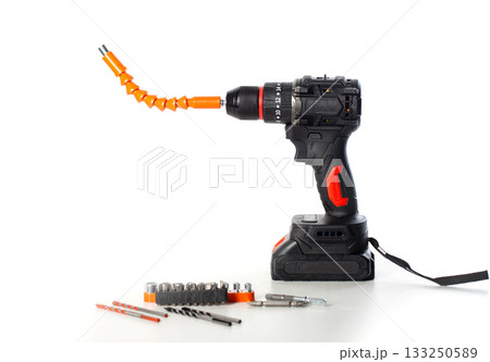 Cordless drill with flexible shaft and tool accessories displayed on a white background for DIY projects, isolate Cordless drill with flexible shaft and tool accessories displayed on a white background for DIY projects, isolate 133250589