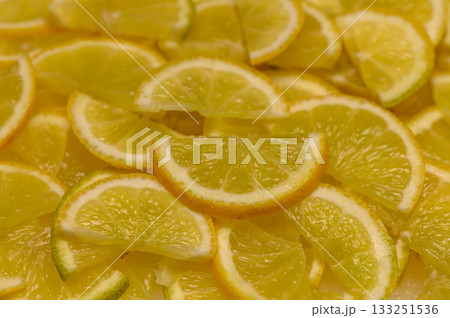 Delightful citrus slices laid out on a surface, showcasing a vibrant yellow feast for the senses 133251536