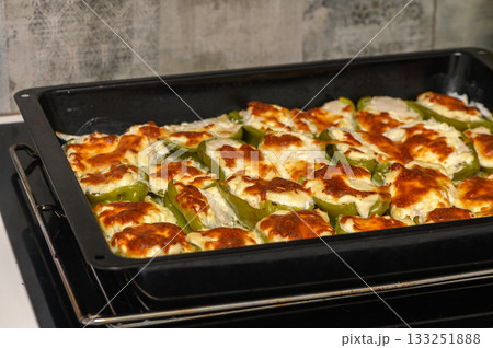 Delicious stuffed bell peppers baked to perfection, a vibrant dish ready to savor and enjoy at any meal Delicious stuffed bell peppers baked to perfection, a vibrant dish ready to savor and enjoy at any meal 133251888