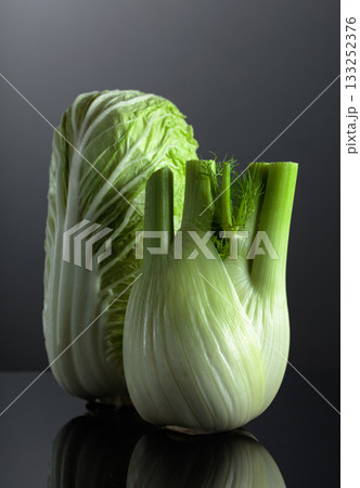Fresh Chinese cabbage and fennel bulb on a black background. Fresh Chinese cabbage and fennel bulb on a black background. 133252376