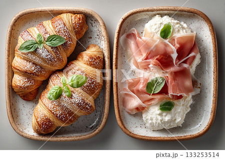 Meal-prep friendly. Top view. Tray with cornetti, prosciutto and fresh ricotta in plate on a white background. Italian spread. European hotel breakfast.  133253514