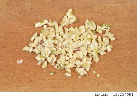 Chopped Garlic on Cutting Board 133254091