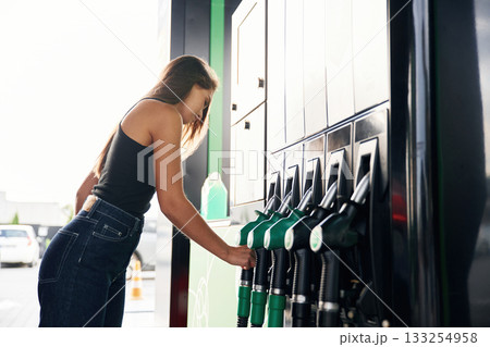 Young woman on the gas station Young woman on the gas station 133254958
