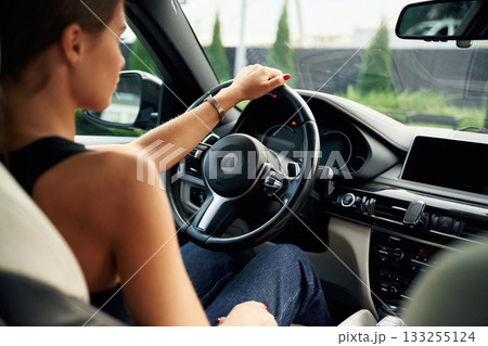 Woman is sitting in the car 133255124