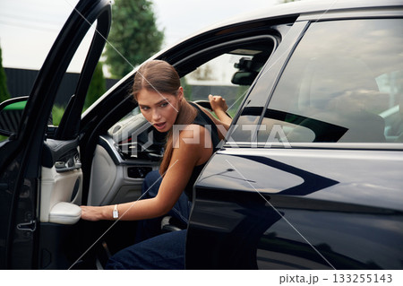 Accident, shocked facial expression. Woman is sitting in the car 133255143