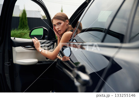 Accident, shocked facial expression. Woman is sitting in the car Accident, shocked facial expression. Woman is sitting in the car 133255146
