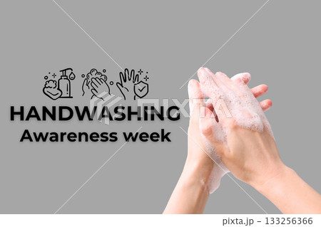 Hands with soap bubbles demonstrate handwashing practices 133256366