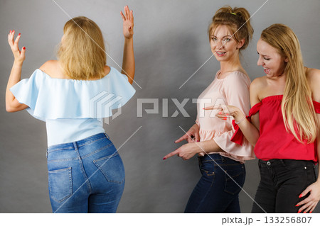 Women gossiping about friend body shape Women gossiping about friend body shape 133256807