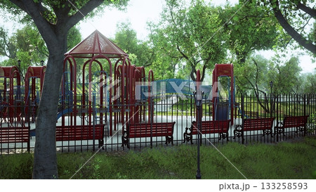 Bright playground filled with red climbing equipment and blue slides surrounded by lush green trees. Wooden benches line the path, inviting relaxation in a peaceful park atmosphere. Bright playground filled with red climbing equipment and blue slides surrounded by lush green trees. Wooden benches line the path, inviting relaxation in a peaceful park atmosphere. 133258593