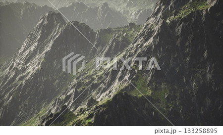 Rugged mountain peaks create a breathtaking view under soft lighting. Lush green patches contrast with rocky surfaces, highlighting natures beauty in a serene and tranquil setting. Rugged mountain peaks create a breathtaking view under soft lighting. Lush green patches contrast with rocky surfaces, highlighting natures beauty in a serene and tranquil setting. 133258895