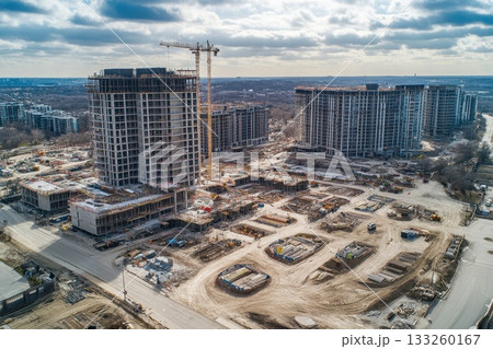 Wide Angle View of Real Estate Development Construction Site with Cranes and Buildings 133260167